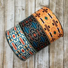 Aztec Design ribbon printed in three color ways of orange, black and cream printed on 1.5" white grosgrain