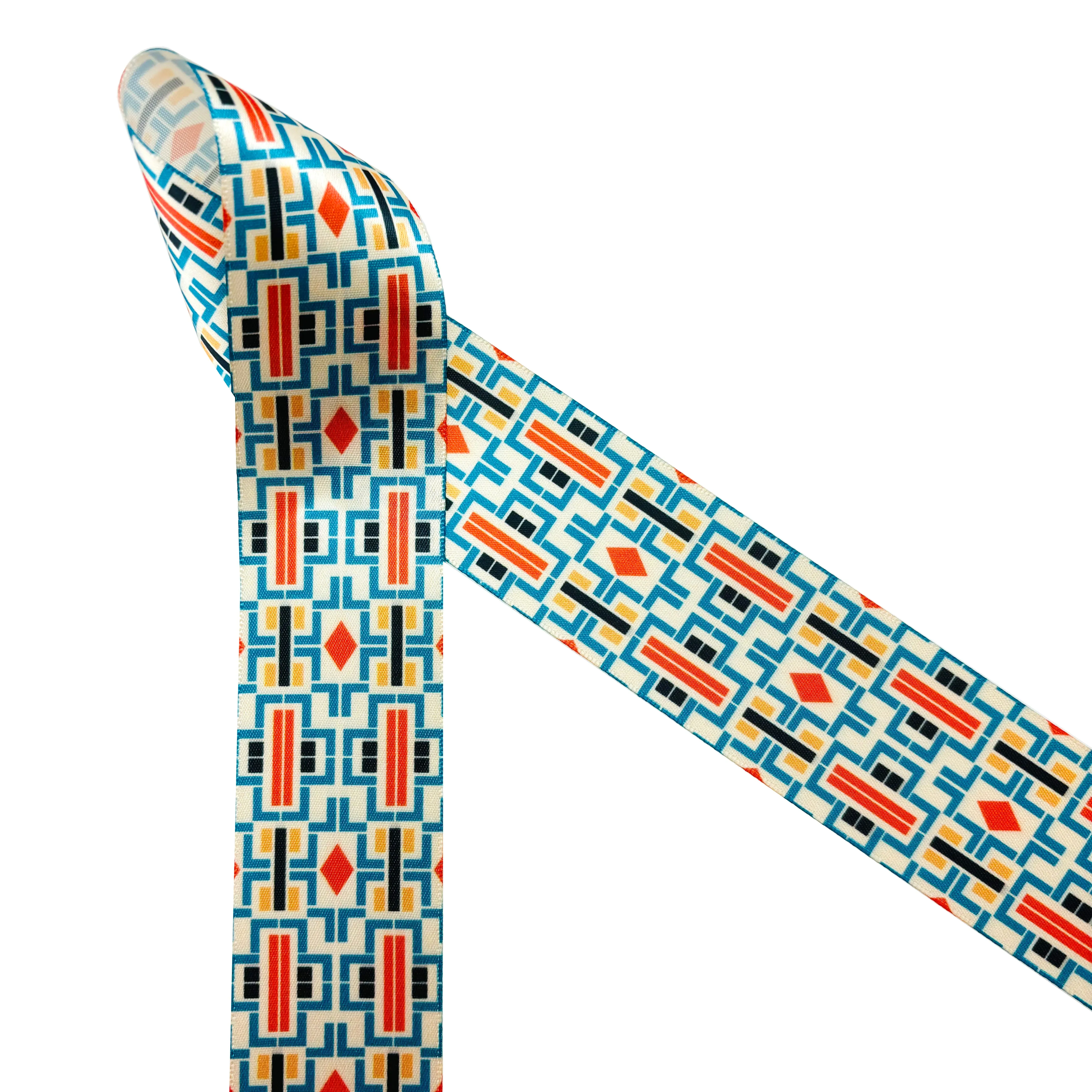 Aztec Design ribbon printed in three color ways of orange, black and cream printed on 1.5" white grosgrain