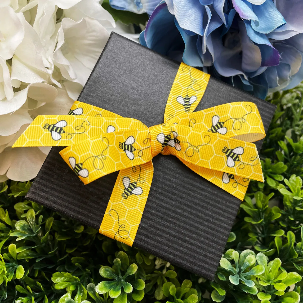 Buzzing Bees Ribbon with a yellow comb printed on 5/8", 7/8" and 1.5"  white grosgrain