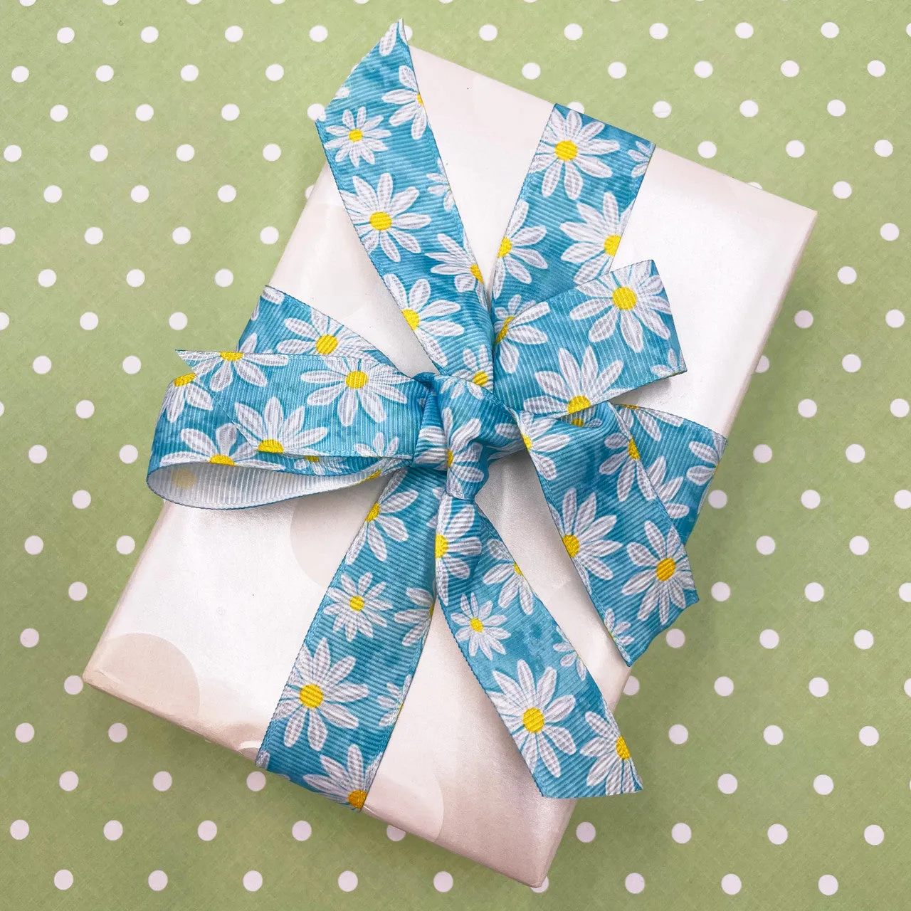 Daisy ribbon daisy blossoms on a watercolor blue background printed on 7/8" grosgrain
