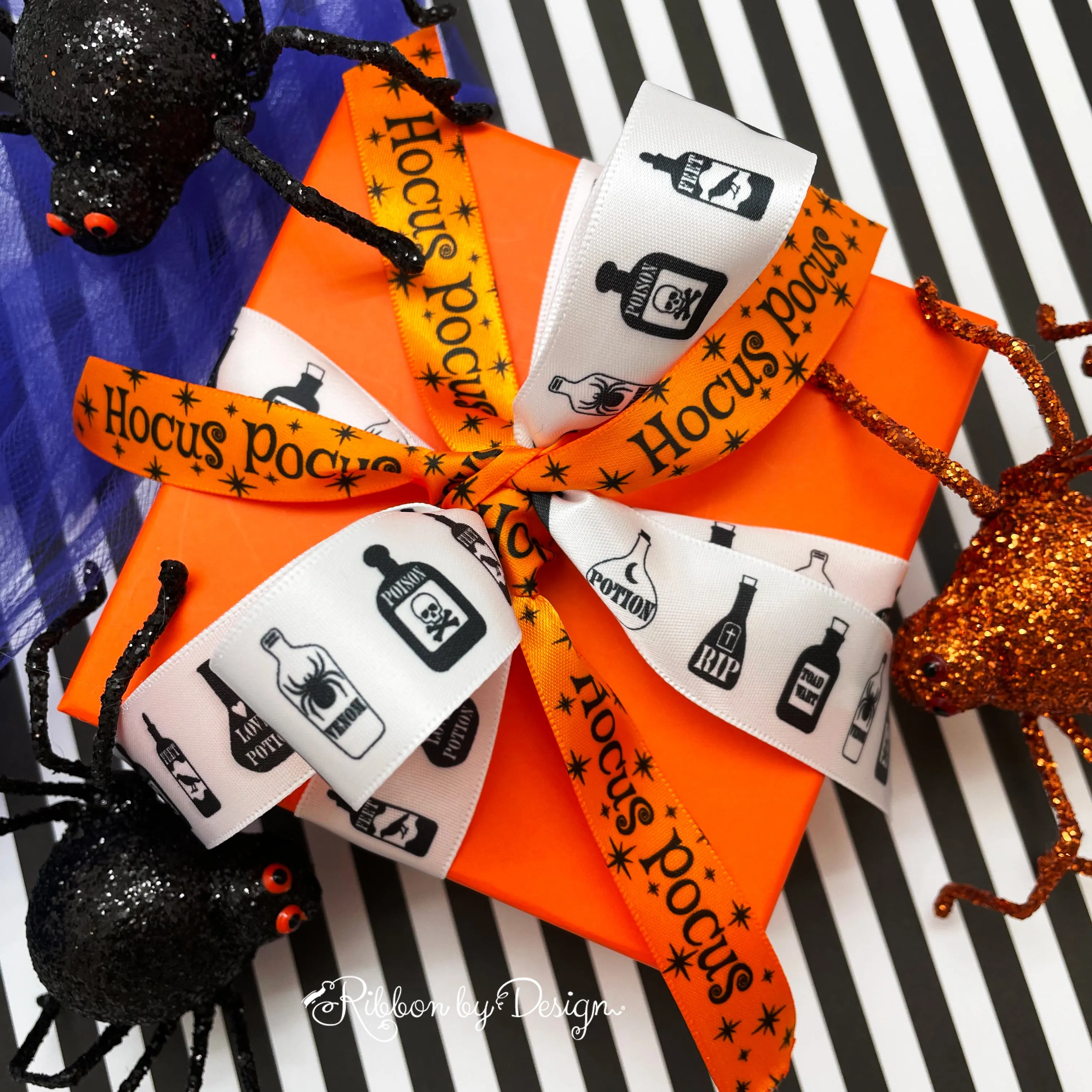 Hocus Pocus ribbon with black ink printed on 5/8" tangerine single face satin