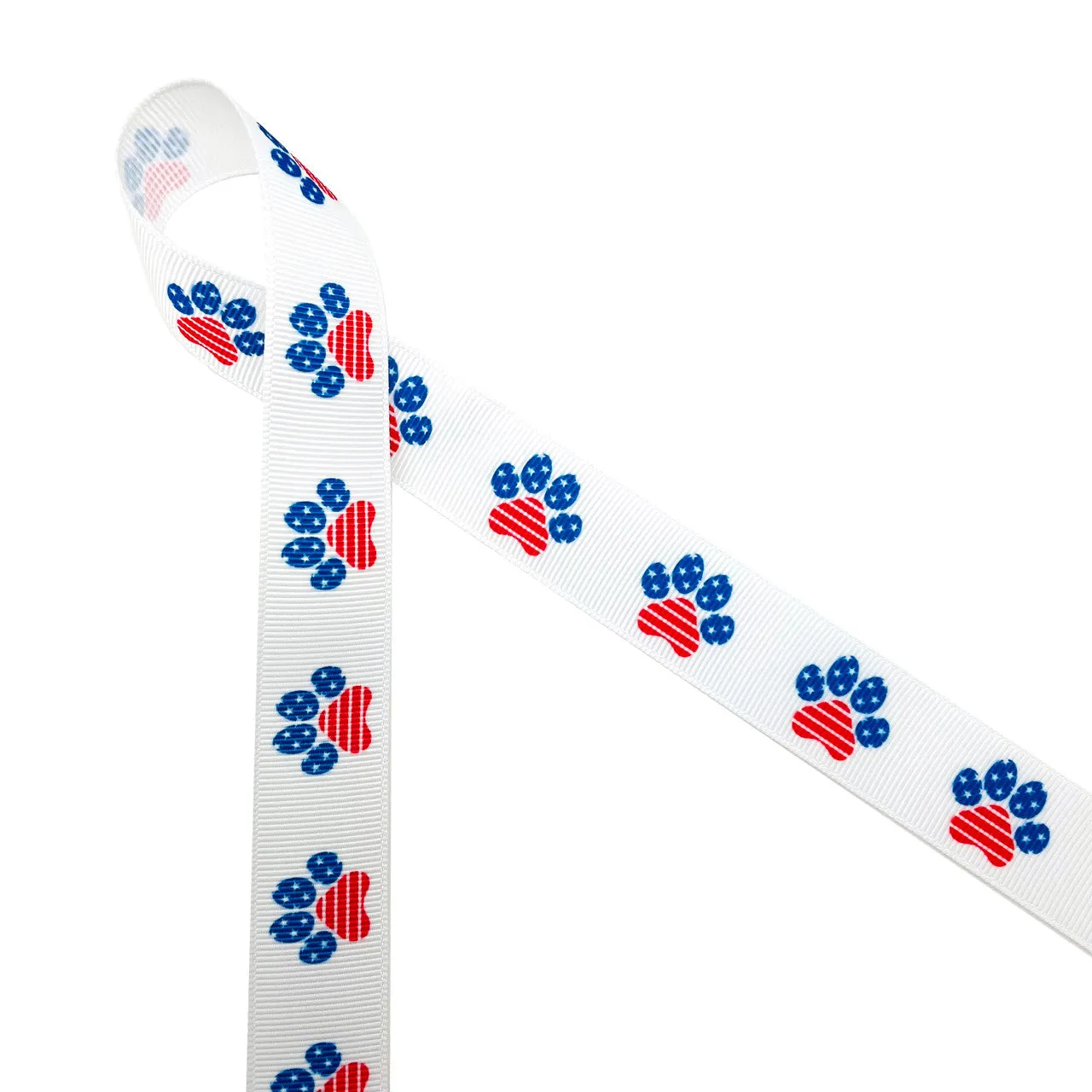 Patriotic paw print ribbon in red white and blue printed on 7/8"  white grosgrain and Satin