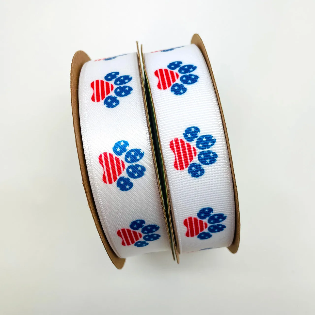 Patriotic paw print ribbon in red white and blue printed on 7/8"  white grosgrain and Satin