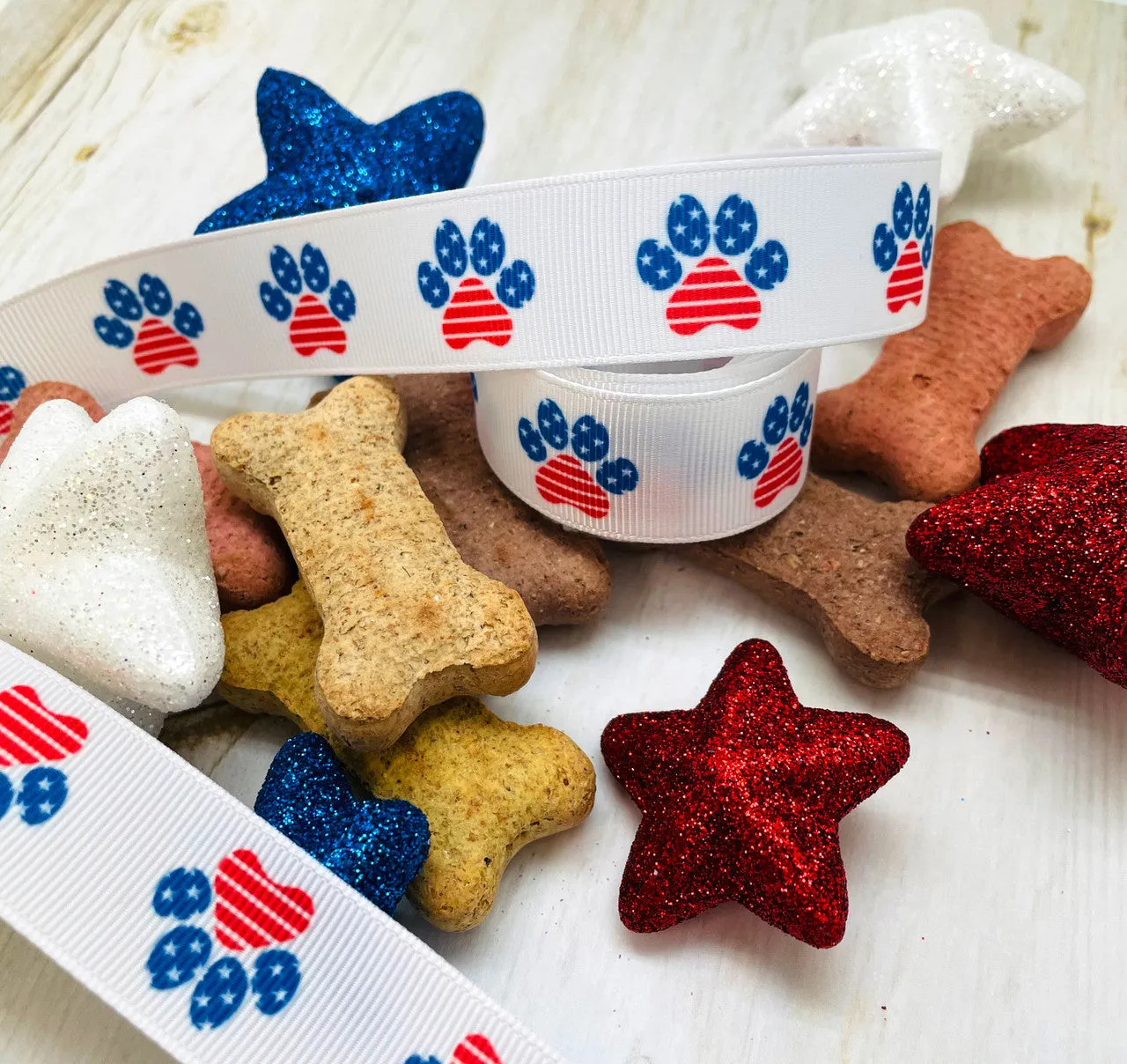 Patriotic paw print ribbon in red white and blue printed on 7/8"  white grosgrain and Satin