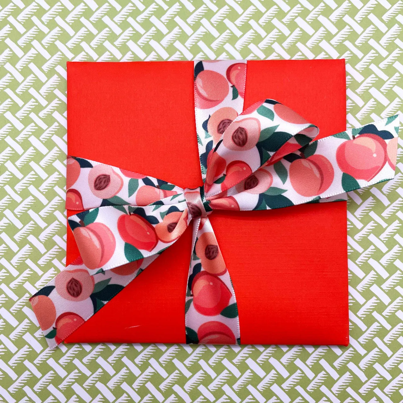 Peaches ribbon peach halves with pits and leaves printed on 7/8" white satin ribbon
