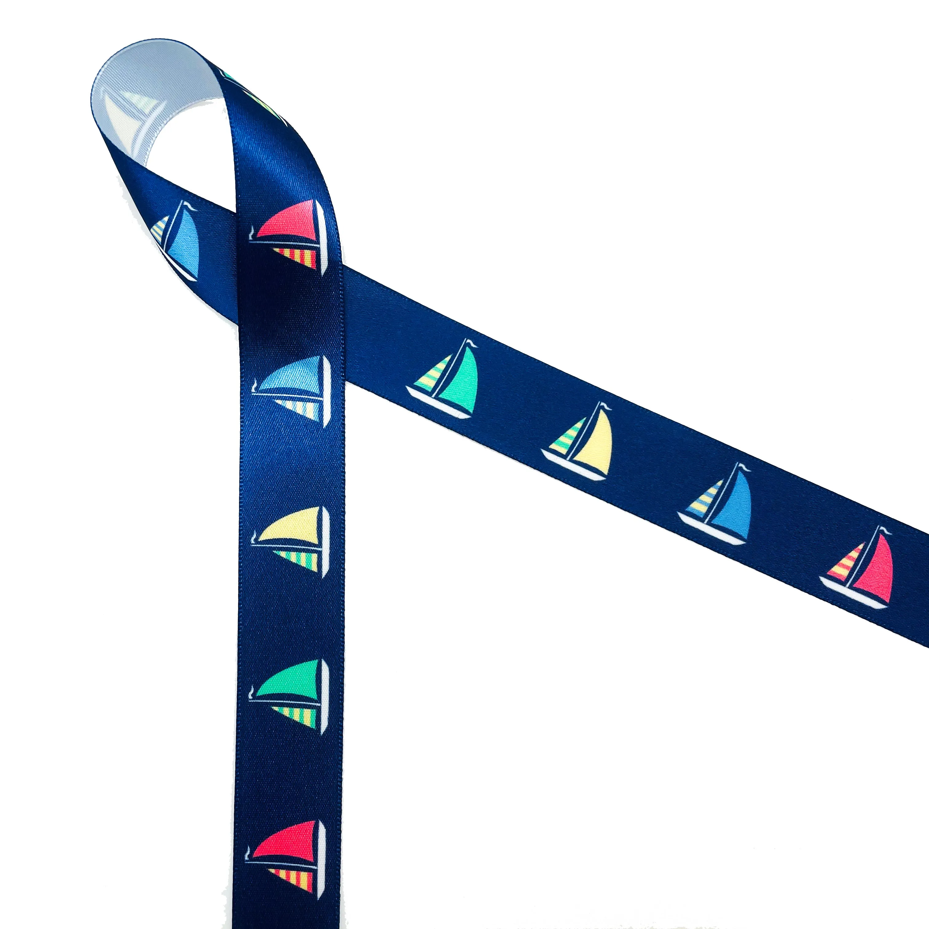 Sailboat ribbon Sailboats with green, yellow, blue and red sails on a navy background printed on 7/8" white satin and grosgrain