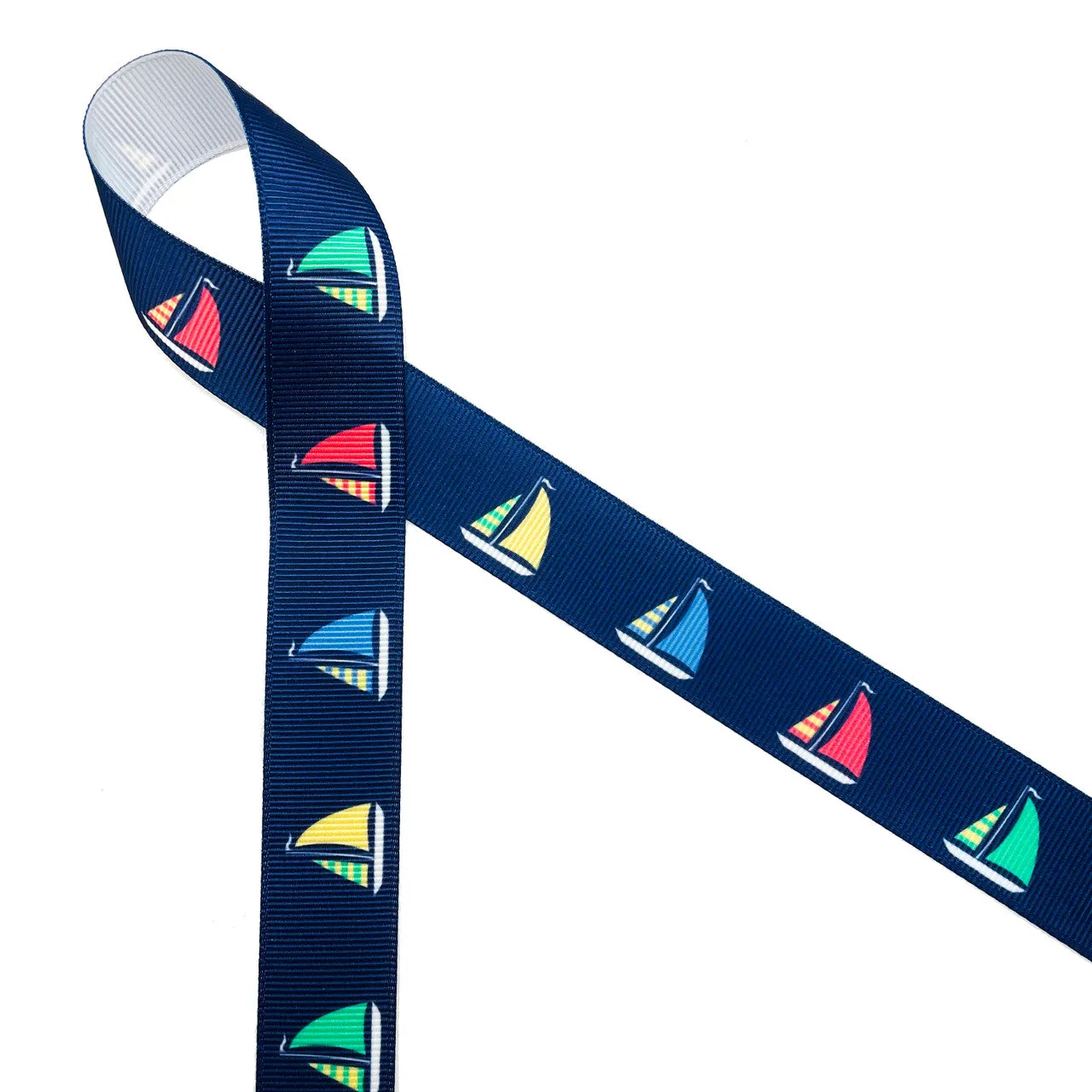 Sailboat ribbon Sailboats with green, yellow, blue and red sails on a navy background printed on 7/8" white satin and grosgrain