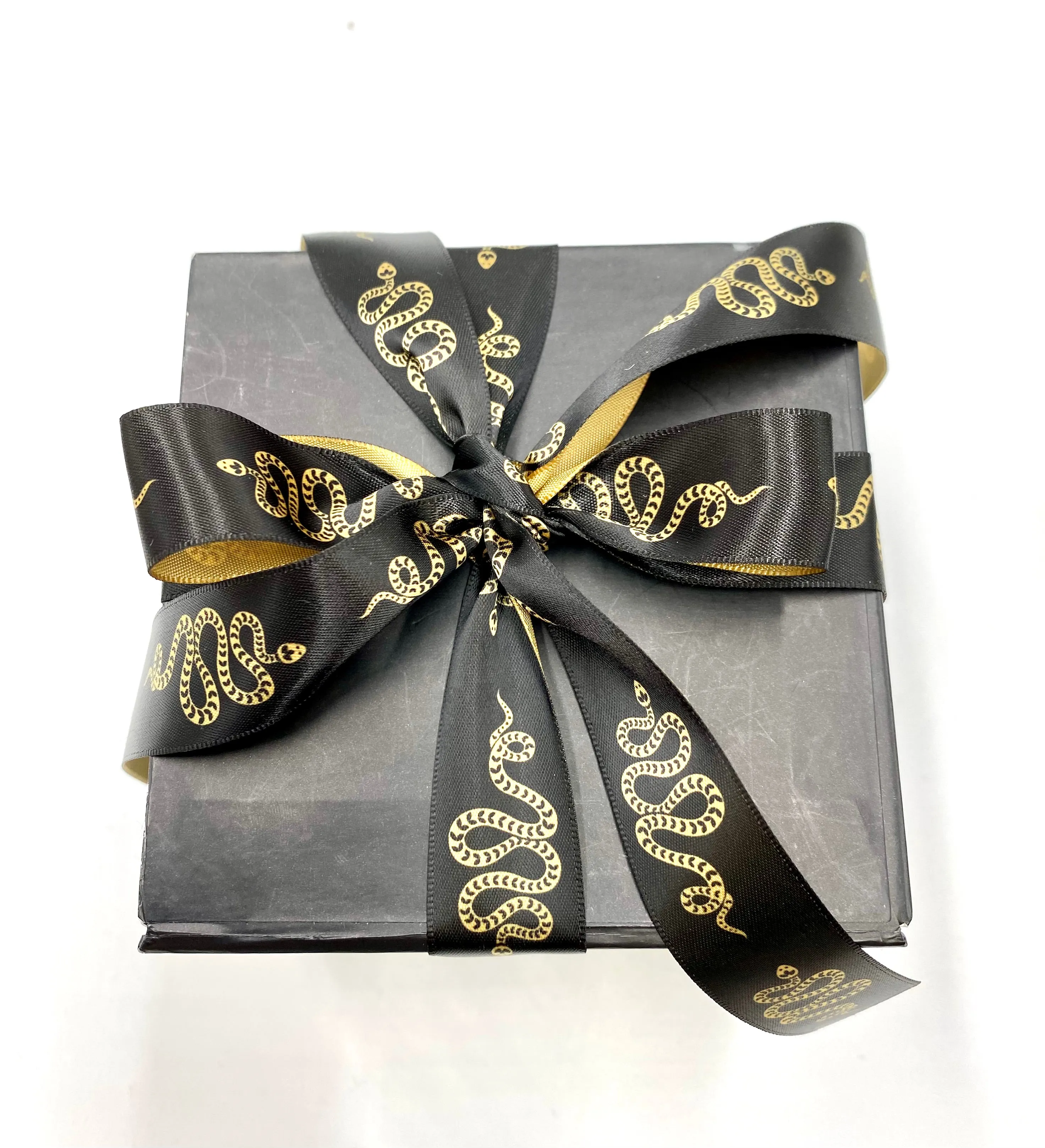 Snake Ribbon gold snakes slithering on a black background printed on 7/8" gold satin